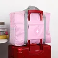 Pink foldable large capacity travel bag with luggage trolley sleeve for suitcases - Pink
