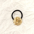 Black high-elastic hair tie featuring a hammered gold hollow circular metal ornament - Gold Round Liquid Texture 3.5cm
