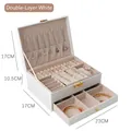White double-layer leather jewelry box with golden lock and tiered compartments - White