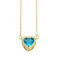 Minimalist gold chain necklace featuring a faceted sea blue heart-shaped pendant - Light Blue