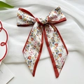 Floral print bow hair tie with red trim on white fabric background for women - Red Border Little Daisy