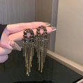 Long black tassel drop earrings with gold-plated flower design and sparkling rhinestones - Black U-Shaped