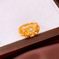Detailed macro shot of vintage gold flower rings with crystals on a white linen surface - Ring - Gold