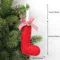 Red felt Christmas boot ornament with plaid bow and bell hanging on a festive tree branch - L-Bell