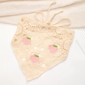 Detailed macro view of handmade crochet knit triangle headscarf with pink peach patterns - Cream White Peach Pattern Bandana