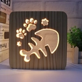 Hollow fish bone and cat paw wooden night light with warm yellow LED illumination - Fish Bone/15cm