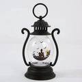 Close-up of a black Halloween lantern featuring a haunted house and bat silhouette - Castle