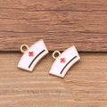 Set of 2 white enamel nurse hat charms with red cross and golden metal edges - Nurse Hat / Gold/White