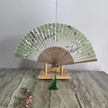 Chinese style folding fan with light green floral pattern and a green silk tassel - Spring Garden (Green)
