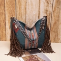 Detail of woven geometric pattern and long leather tassels on Bohemian tote bag - Royal Blue