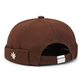 Dark brown cotton docker hat with adjustable metal buckle and golden leaf emblem - Brown