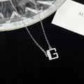 Sparkling S925 silver necklace featuring a crystal-encrusted letter G pendant on black velvet - 925 Silver / Silver (Initial G)
