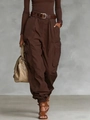 Close-up of high-waisted deep brown cargo pants with side pockets and matching belt - Coffee