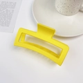 Detail of a large 13cm matte yellow square shark hair claw clip on a stylish desk setting - 13cm Extra Large Square Claw-Bright Yellow