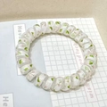 Spiral telephone wire hair tie with pink floral pattern on a white base - Fresh Peach Blossom