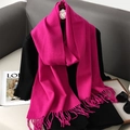 Detail of rose red cashmere scarf with fringe tassels on black stylish outfit - Rose Red
