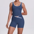 Detail of high-waist yoga set with cross-back design and contrast trim in navy blue - S / Navy Blue