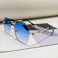 Lunettes de soleil vintage à monture dorée évidée et verres bleus dégradés - Monture Dorée Verres Bleus Dégradés