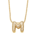 Gold plated necklace with letter M pendant featuring pavé set white zircon stones - M