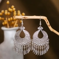 Macro detail of silver hollow leaf earrings with ethnic feather tassels on wood - Silver Retro Feather Tassel(E2875-13)