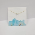 Golden cross chain necklace with irregular turquoise gemstone on white display card - Necklace Only Without Card / Turquoise