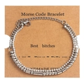 Detail of Morse Code double-layer bracelet with rhinestones on a craft card - Best Bitches Silver