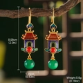 Detail of vintage palace style enamel earrings featuring a red pagoda and green bead - Court Pavilion Style (GF0412)