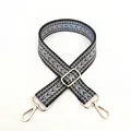 Macro detail of ethnic geometric woven strap with purple patterns and gold metal buckles - Size 17