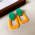 Detailed view of colorful geometric resin drop earrings in vibrant green and orange - 76# Silver Needle - Green Orange Geometric Contrast