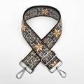 Detailed macro view of ethnic jacquard embroidered strap with silver alloy swivel hooks - Light Brown (Silver Buckle)