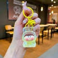Detailed shot of yellow liquid acrylic keychain with cute cartoon figure and bell accessory - Lobster Clasp Style / Noctilucent Bubble Bead Yellow