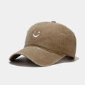 Macro detail of smiley face embroidery on a vintage washed cotton baseball cap - Adjustable / Khaki