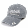 Detail of New Orleans jazz embroidery and washed cotton texture on grey baseball cap - Gray