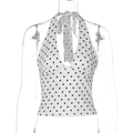 Detail view of polka dot halter top featuring a deep V-neck and backless tie-up design - S / White
