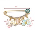 Golden Evil Eye safety pin brooch featuring colorful enamel baby-themed charms and rhinestones - Gold Baby Bottle - Unicorn