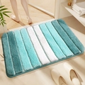 Blue and white gradient striped absorbent plush bath mat in a bathroom setting - Piano Key - Azure