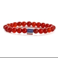 Detailed close-up of red agate beads with a rectangular USA flag charm on elastic cord - Red Agate Short