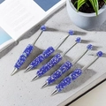 Five creative blue glitter pens with sparkling beaded barrels on a modern desk - Dark Blue
