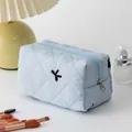Light blue floral quilted makeup bag with classic diamond stitching and zipper closure - Embroidered Bow Blue