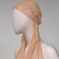 Close-up of sparkling champagne rhinestones on delicate mesh headscarf for party wear - Nude