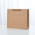 Medium brown kraft paper gift bag with wide woven handles and reinforced bottom structure - Extra Large Horizontal Style