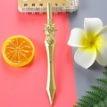 Creative golden sword-shaped gel pen with intricate dragon relief on the hilt - Phoenix Sword - Gold / 0.5mm