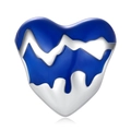 Macro shot of a heart-shaped silver charm featuring dripping blue enamel details - Adoration Heart Charm