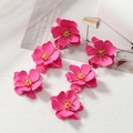 Fashionable long pink flower drop earrings with golden stamens over white textured surface - Rose Red