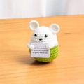 Handmade crochet mouse plush in white and green holding an inspirational quote card - Small Hamster