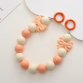 Detail of candy-colored 16mm acrylic beads and bow accents with orange clip on chain - K959 Acrylic Bowknot Handheld Chain (Handheld Chain) / White + Orange