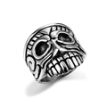 Detailed side view of vintage pirate skull ring featuring intricate scrollwork on silver steel - Realistic Oxidized Skull Style