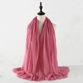 Pink crinkle cotton linen scarf with frayed edges displayed on a studio mannequin - Light Pink