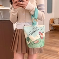 Canvas handbag in white and mint green with wooden ring handles and bear illustration - Floral Piggy