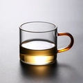 Heat-resistant borosilicate glass tea cup with a distinctive amber-colored handle - Red Handle